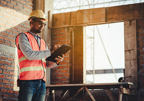 home inspector with orange vest